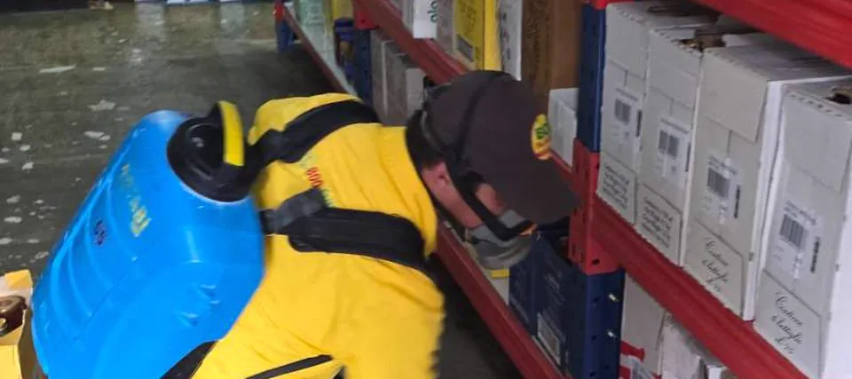 Pest control treatment on warehouse shelving