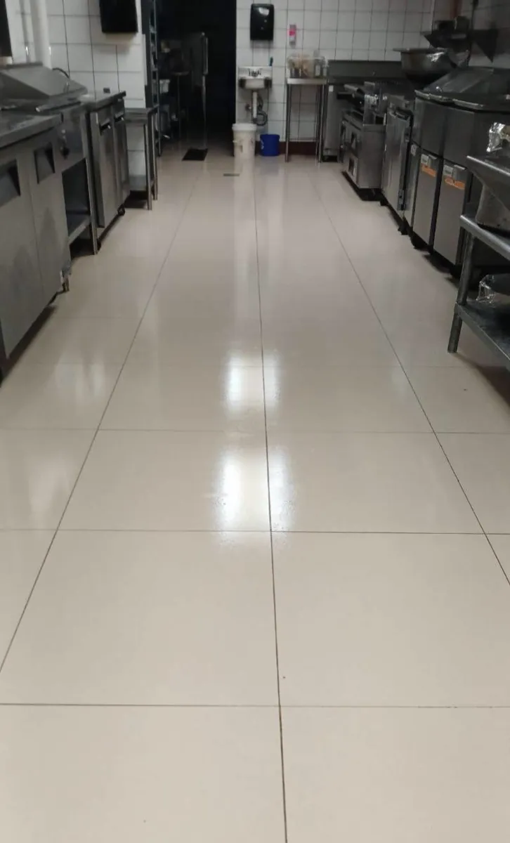 Clean commercial kitchen floor after a pest control service