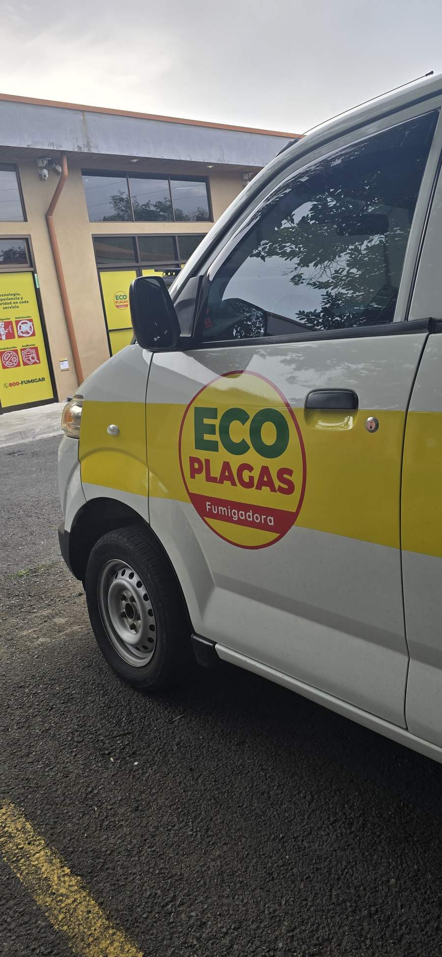 Close-up of the EcoPlagas logo on the van door